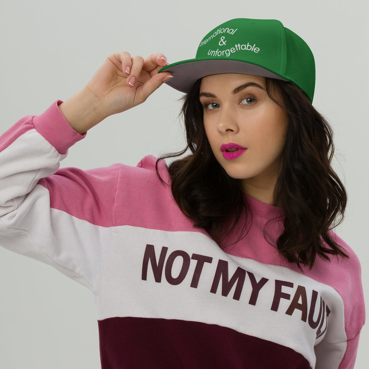 green embroidered hat on female model - Laureles Internacionales Snapback Hat | Serendipitous Landing