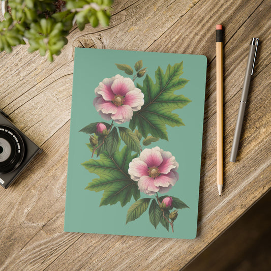 Notebook with floral design on a wooden surface with a pencil and pen. - mugunghwa and oak leaf botanical design - teal / sage green cover, perforated notebook