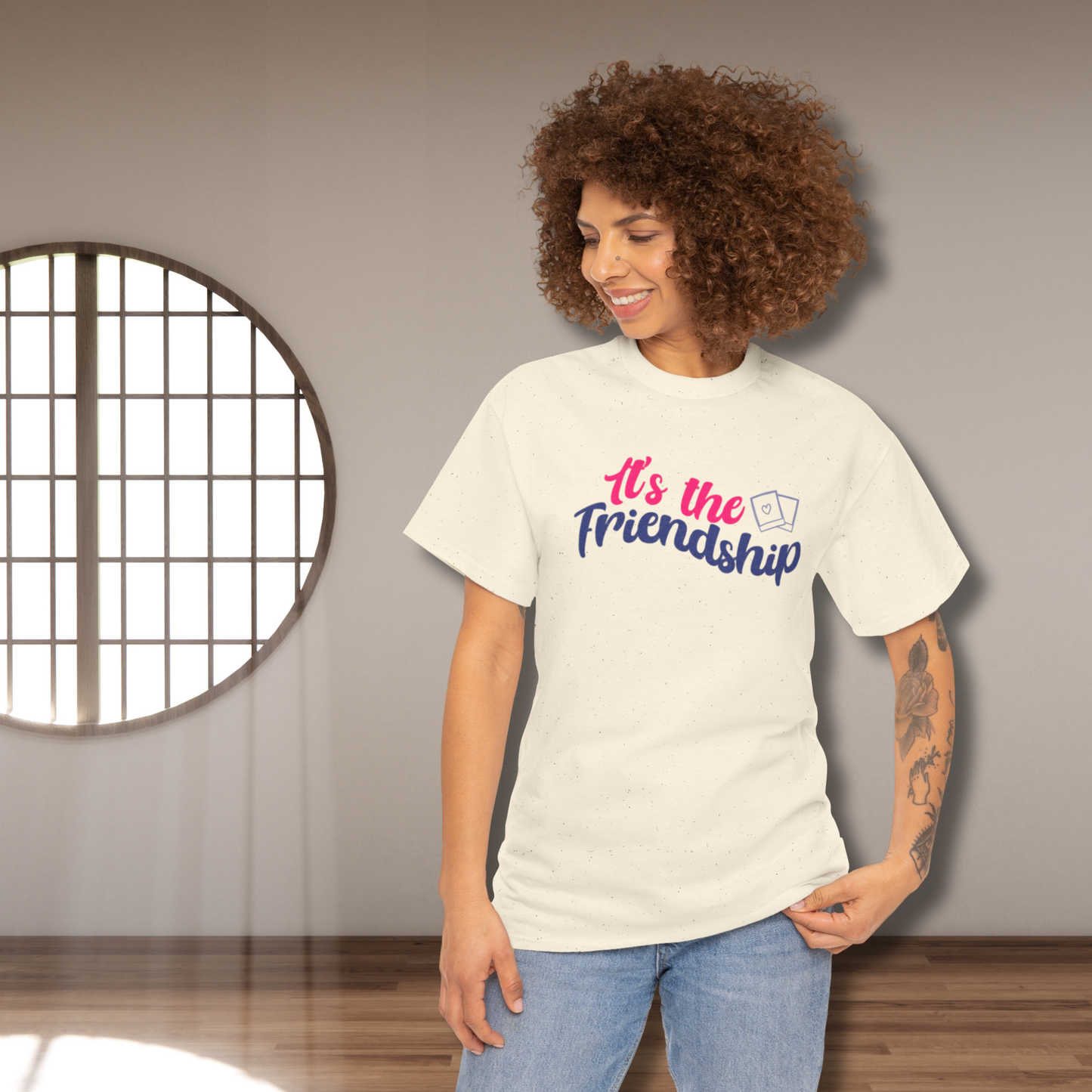 It's the friendship with polaroid image - short sleeve shirt, cream color, Jimin, Jungkook, Jikook, Minimoni, RM; woman wearing the shirt in an empty room with a circular gridded window with light beams coming through on her left