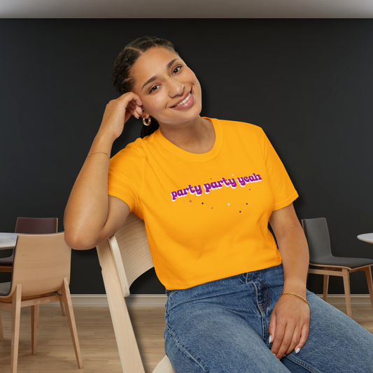 Woman wearing a bright yellow t-shirt with text, sitting in a room with chairs and tables. - Party Party Yeah T-Shirt | Retro Aesthetic K-Pop Meme Shirt, Jungkook