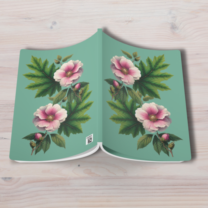 Book with floral design on a light wooden surface - mugunghwa and oak leaf botanical design - teal / sage green cover, perforated notebook