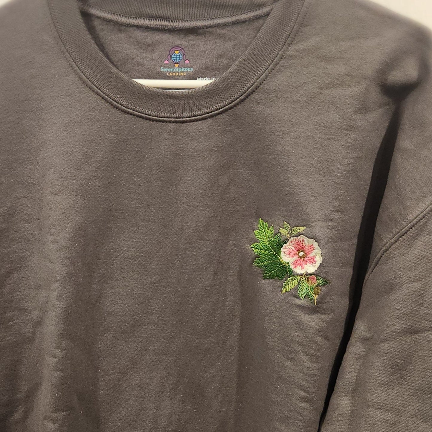 Gray sweatshirt with a floral embroidery on the chest  - mugunghwa and oak leaf botanical design - medium grey gray sweatshirt - [SAMPLE SALE] Mugunghwa & Oak Leaf Embroidered Sweatshirt (Unisex) | Serendipitous Landing