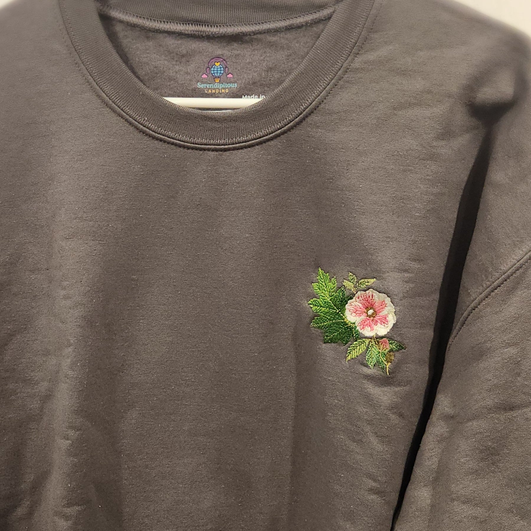 Gray sweatshirt with a floral embroidery on the chest  - mugunghwa and oak leaf botanical design - medium grey gray sweatshirt - [SAMPLE SALE] Mugunghwa & Oak Leaf Embroidered Sweatshirt (Unisex) | Serendipitous Landing