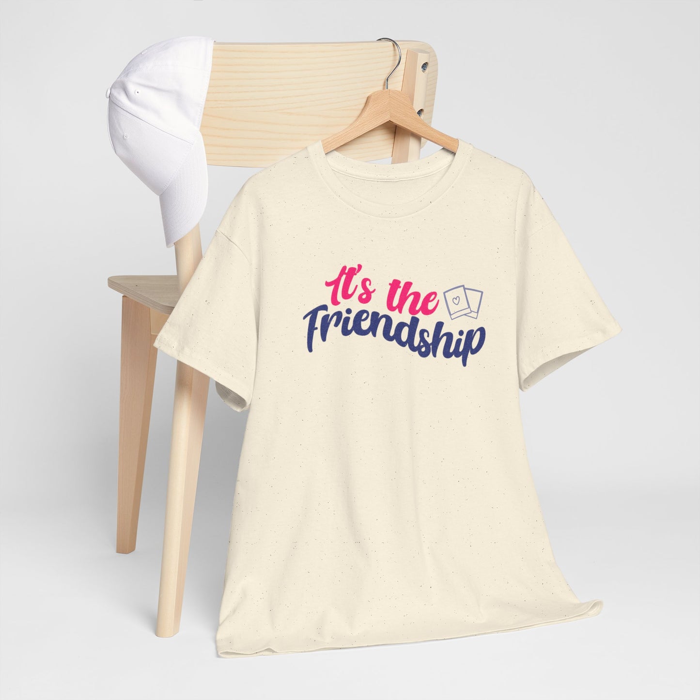 It's the friendship with polaroid image - short sleeve shirt, cream color, Jimin, Jungkook, Jikook, Minimoni, RM; hanging on the back of a wooden chair with a white baseball cap 
