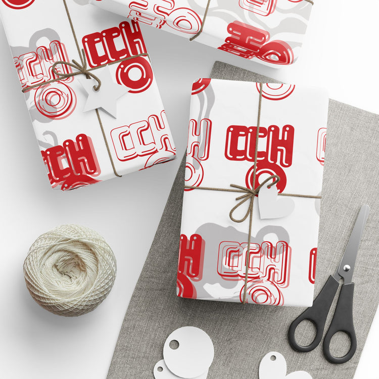 Gift wrap with red and black pattern, tied with string, on a white background. - BTS Rapline "Ddaeng" Inspired Gift Wrapping Paper