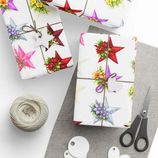 Gift wrap with floral designs, scissors, and twine on a white surface - Seven Stars collection design, bangtan BTS members birth flowers and arirang vinyl colors