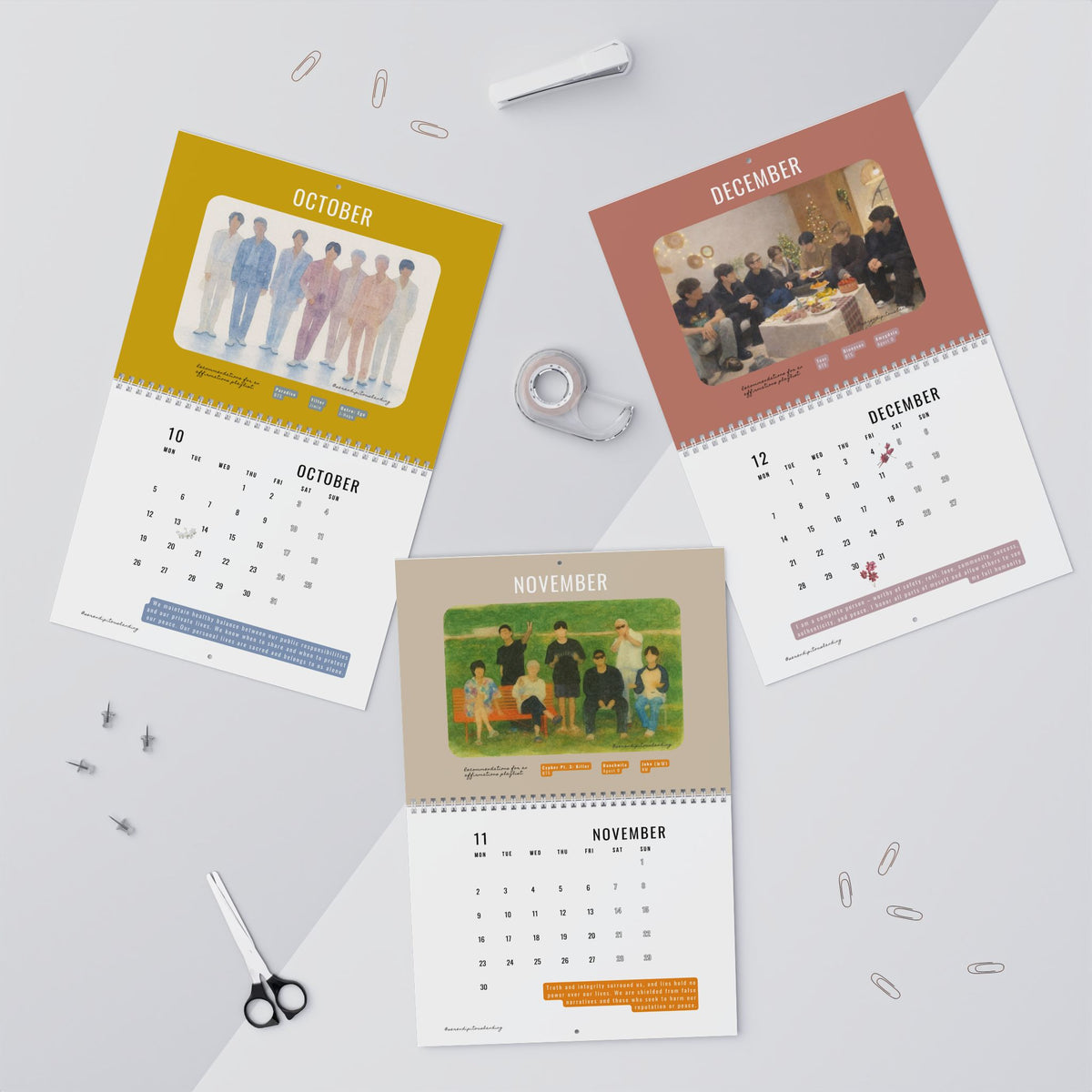 Four calendar pages for October, November, and December on a light gray background with office supplies. - BTS 2026 Wall Calendar - Bangtan Affirmations, OT7 Watercolor Art | Monthly Song Recommendations