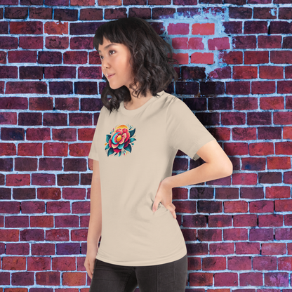 Woman wearing a beige t-shirt with a colorful flower design against a brick wall. The Busan Camellia: Jimin & Jungkook Sun & Moon Duo Aesthetic Tee