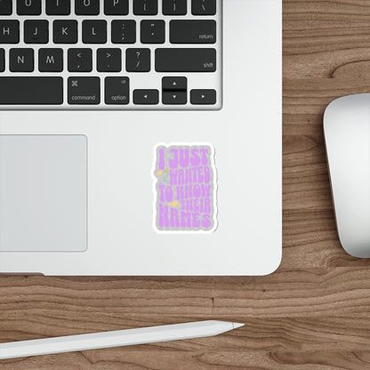 Laptop with a sticker on a wooden desk with a mouse and stylus. - clear sticker witih "I just wanted to know thier names" text, a few small hearts, and a microphone - subtle kpop fan merch