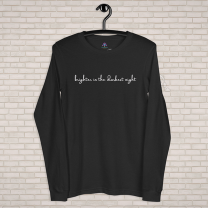 Black long-sleeve shirt with 'brighter in the darkest night' text on a white brick wall background - The Insignia Bloom Long Sleeve Shirt (Unisex) - 7 Stars collection design - BTS / Bangtan members birth flowers and Arirang vinyl colors