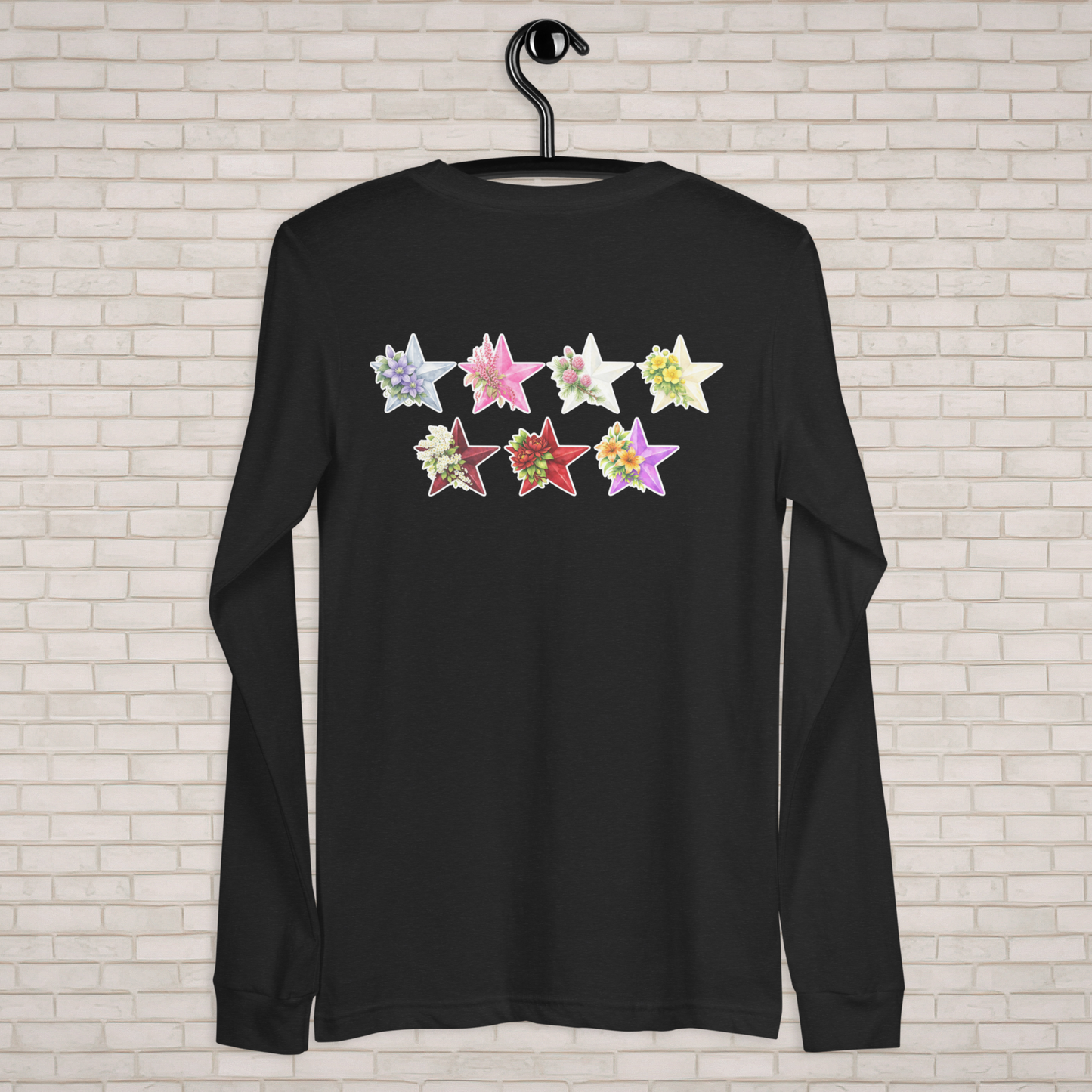 Black long-sleeve shirt with colorful star designs on a brick wall background  - The Insignia Bloom Long Sleeve Shirt (Unisex) - 7 Stars collection design - BTS / Bangtan members birth flowers and Arirang vinyl colors