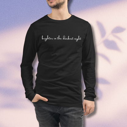 Person wearing a black long-sleeve shirt with text on a gradient background - The Insignia Bloom Long Sleeve Shirt (Unisex) - 7 Stars collection design - BTS / Bangtan members birth flowers and Arirang vinyl colors