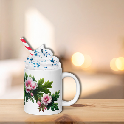 Mug with floral design and whipped cream graphic on a wooden surface with a blurred background - mugunghwa and oak leaf botanical design - 20 oz ceramic mug