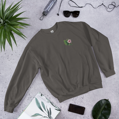 Gray sweatshirt with a floral design on a gray surface with accessories around  - mugunghwa and oak leaf botanical design - medium grey gray sweatshirt - [SAMPLE SALE] Mugunghwa & Oak Leaf Embroidered Sweatshirt (Unisex) | Serendipitous Landing